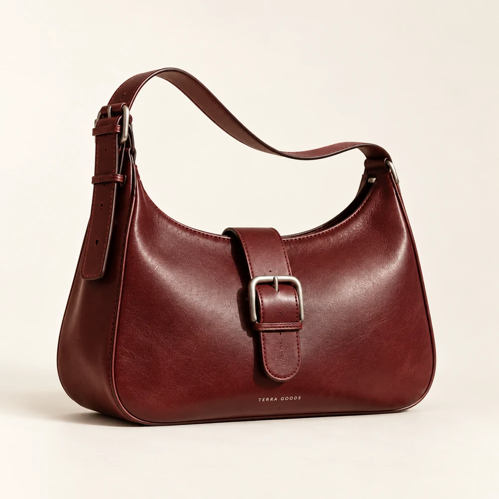 AI studio product photography example: burgundy leather bag with natural texture and a soft contact shadow.